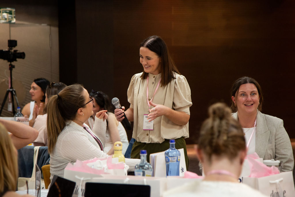 Attendees at a table during a live event